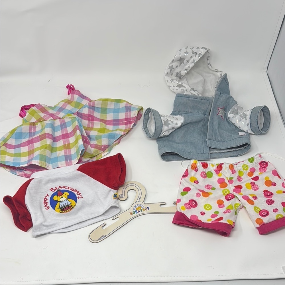 3 build a bear shirts, and a pair of shorts and hanger